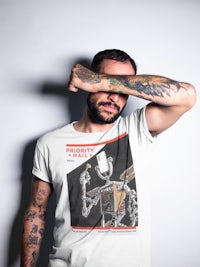 a man wearing a t - shirt with a robot on it