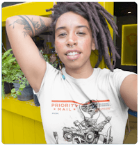 a woman with dreadlocks wearing a t - shirt