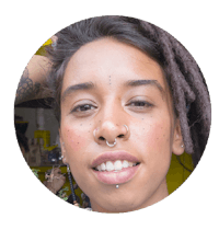 a woman with dreadlocks and piercings
