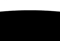a black and white image of a plane flying in the sky
