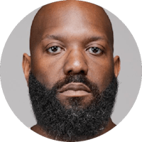 a black man with a beard in a circle